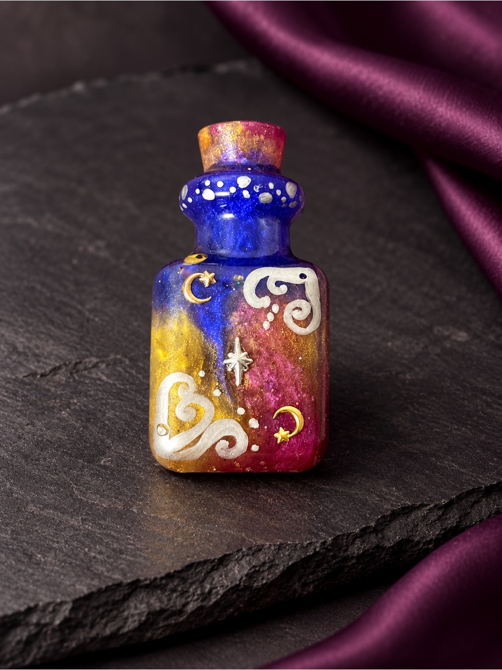 Blue,Pink, and yellow mini resin potion bottle with silver and moon accents